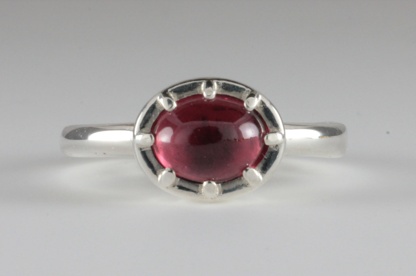 Cutdown 8-claw Georgian style Oval Garnet Cabochon Ring